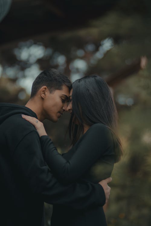 Photo of a Couple Touching Foreheads 