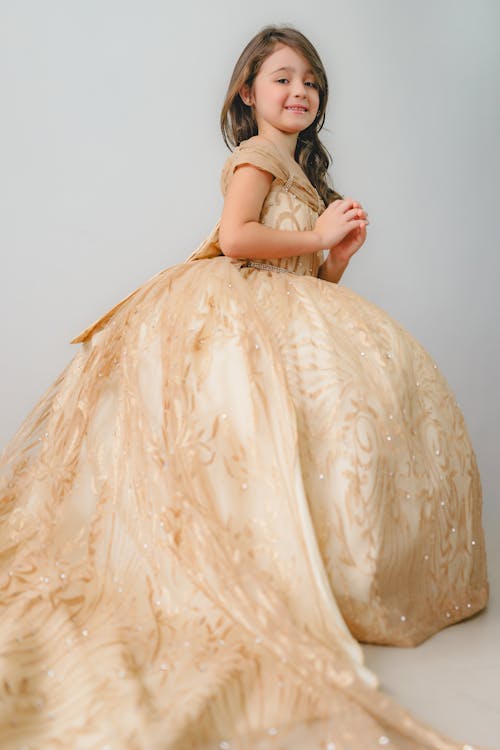 A Little Girl in a Gold Princess Dress 