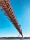 Low Angle Photo of Bridge Under Blue Sky