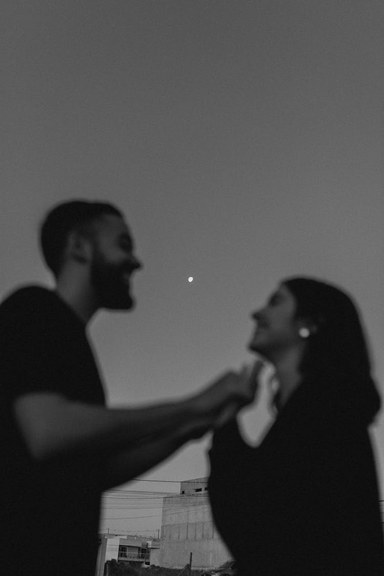 Cheerful Young Couple In Black And White