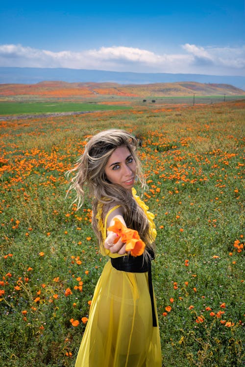 Blonde Woman Wearing Yellow Dress on a Field 