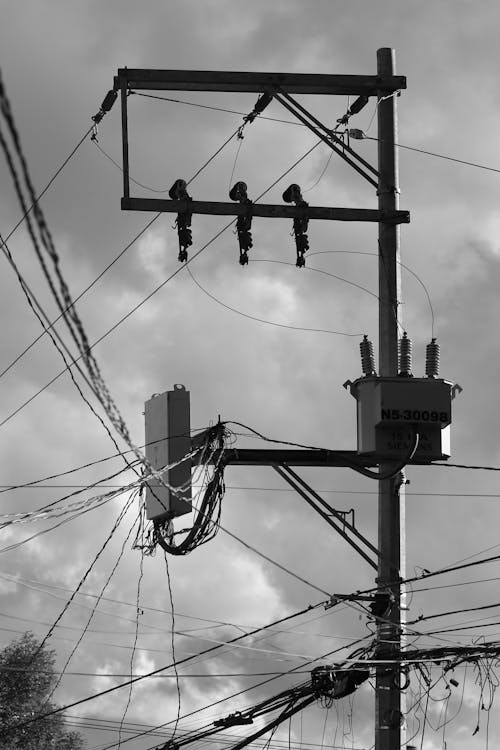 Black and White Photo of Electric Cables on a Utility Post