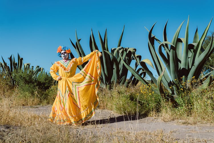 Woman Dressed For Mexican Day Of The Dead Dancing In The Desert 