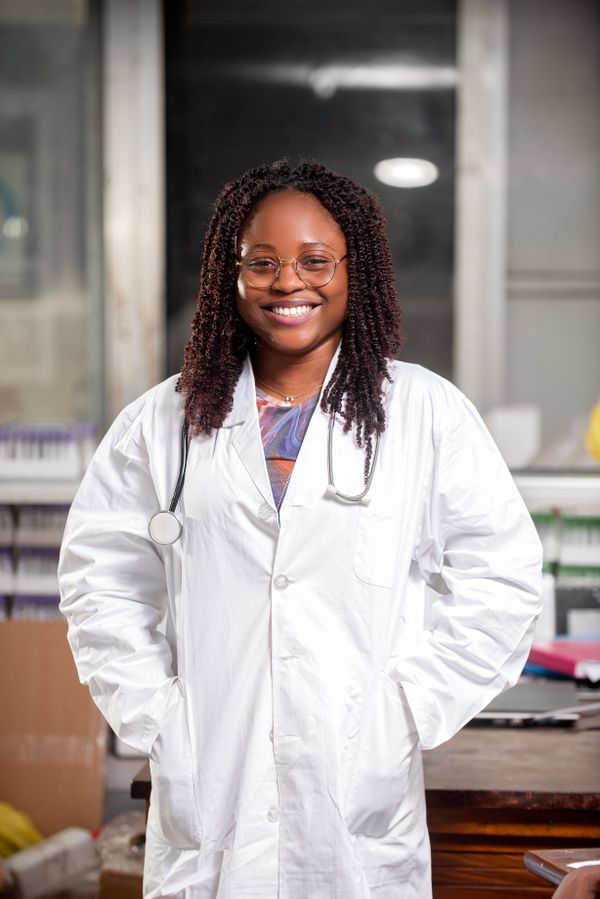 Dr Grace Adeyemi, a doctor in a white lab coat with a stethoscope