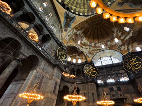 Free Detailed view of the Hagia Sophia's grand interior with chandeliers and arches in Istanbul. Stock Photo
