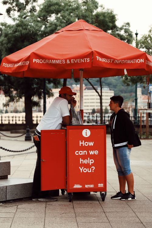 Free Street scene with a red tourist information booth in Budapest, Hungary. Stock Photo