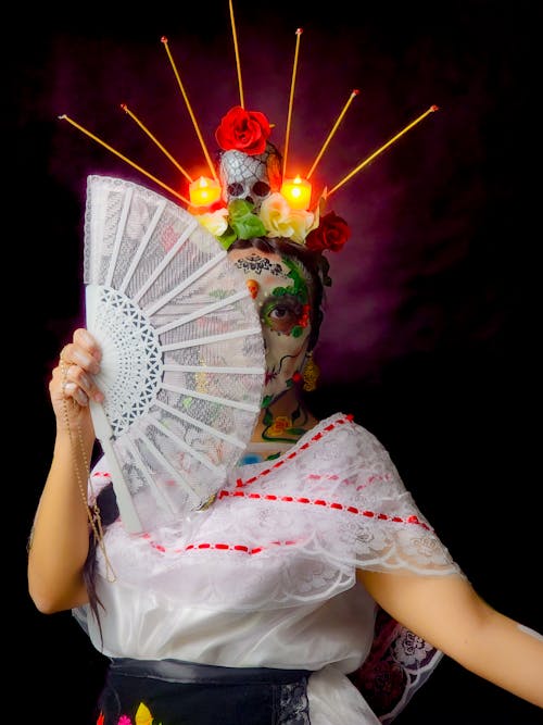 Portrait of Woman Wearing Mexican Costume Holding a Range 
