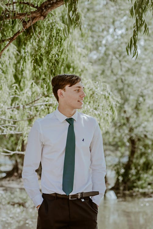 Young Man in White Shirt and Green Tie