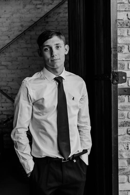 Black and White Portrait of a Man Wearing White Shirt and a Necktie