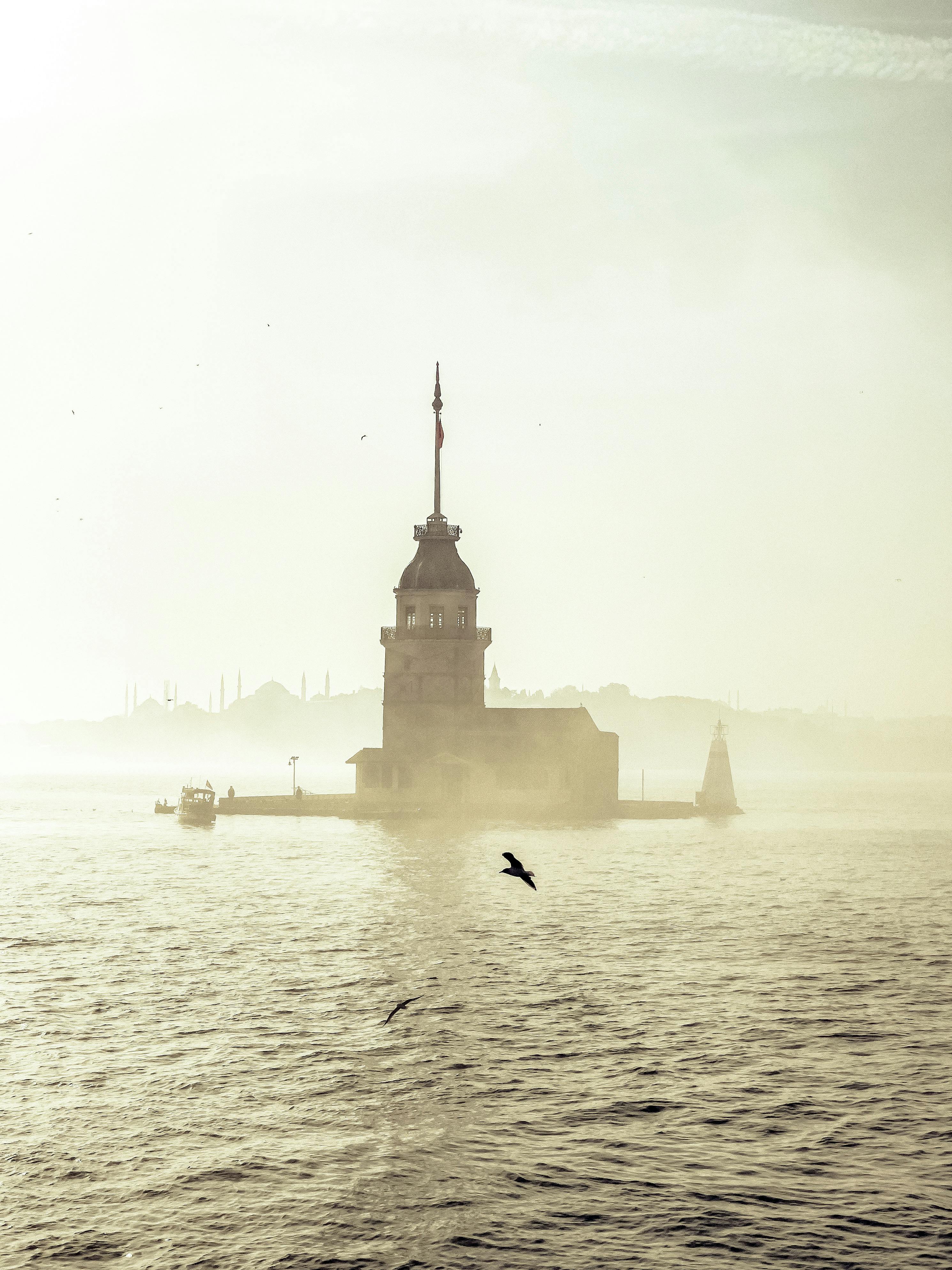 A serene misty morning captures the iconic Maiden's Tower in Istanbul, Turkey.