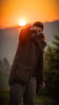 A photographer takes a shot during a stunning sunset in the forests of Bolu, Türkiye.