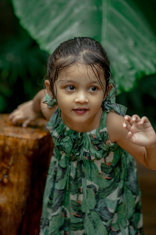Portrait of Girl Among Tropical Leaves 