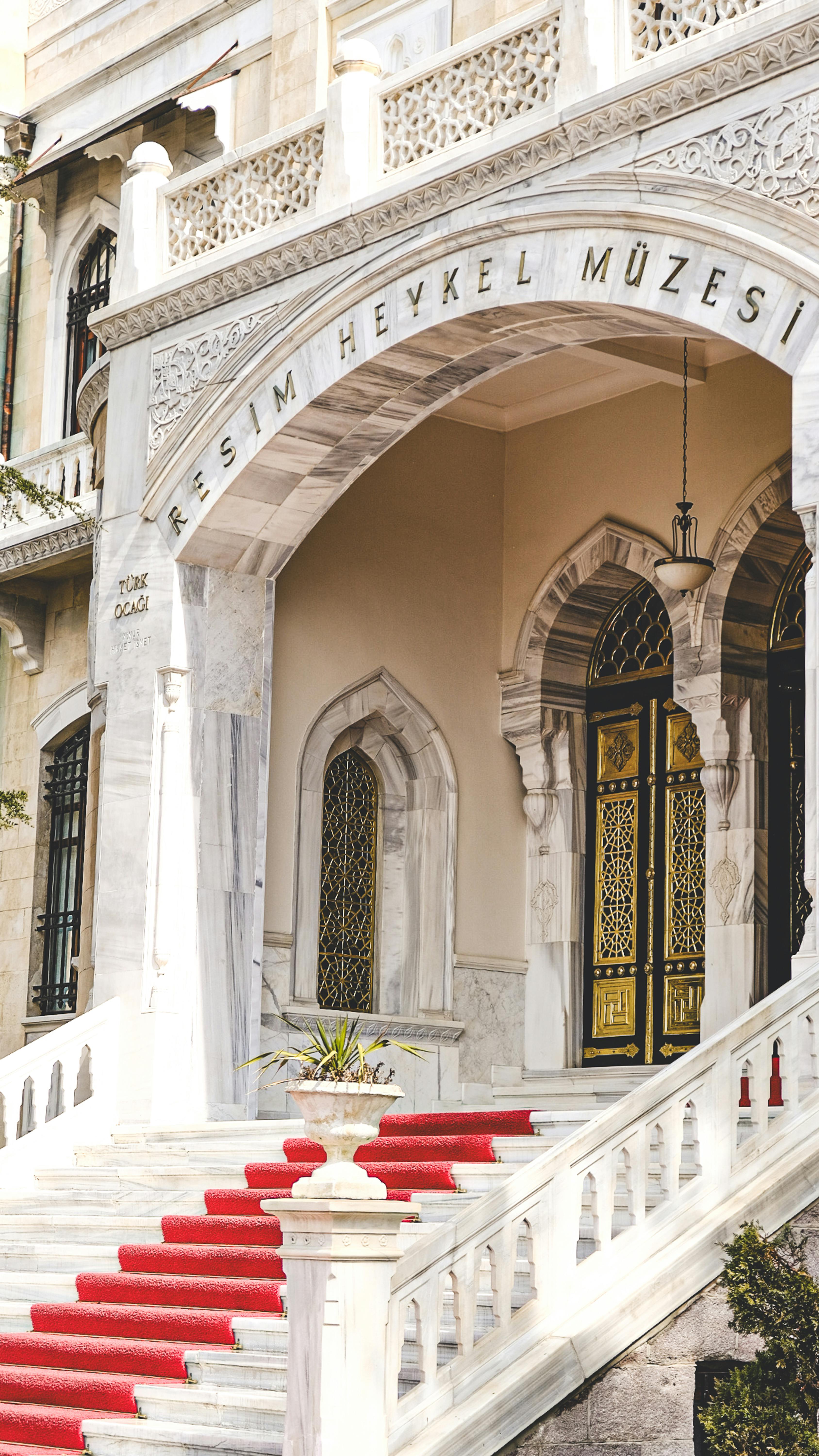 Majestic entrance with red carpet at Ankara's Resim Heykel Müzesi, showcasing luxurious architecture.