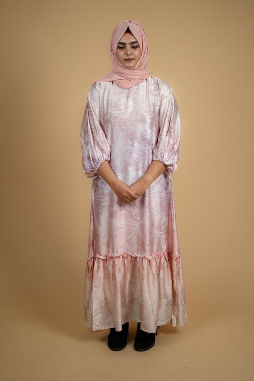 Model in a Pink Long Dress and a Headscarf