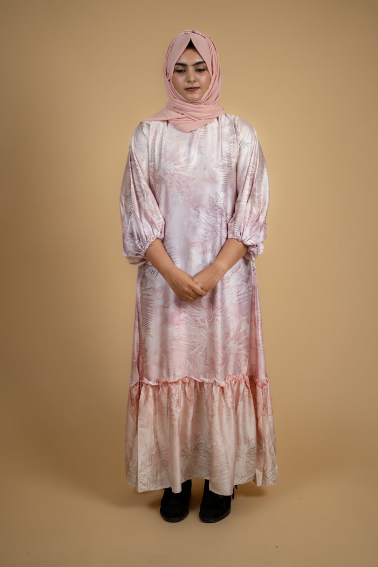 Model In A Pink Long Dress And A Headscarf