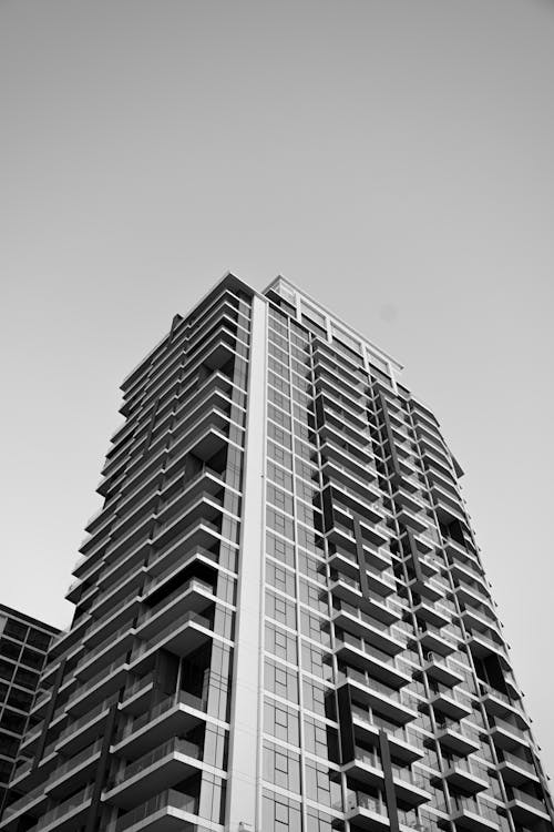Black and white photo of tall building with windows