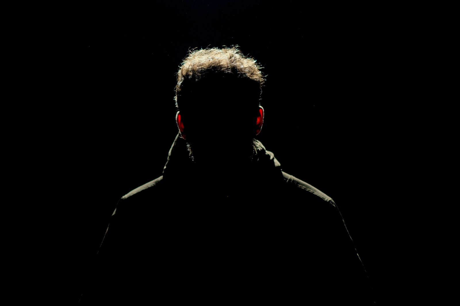 Silhouette of Man in a Dark Room · Free Stock Photo