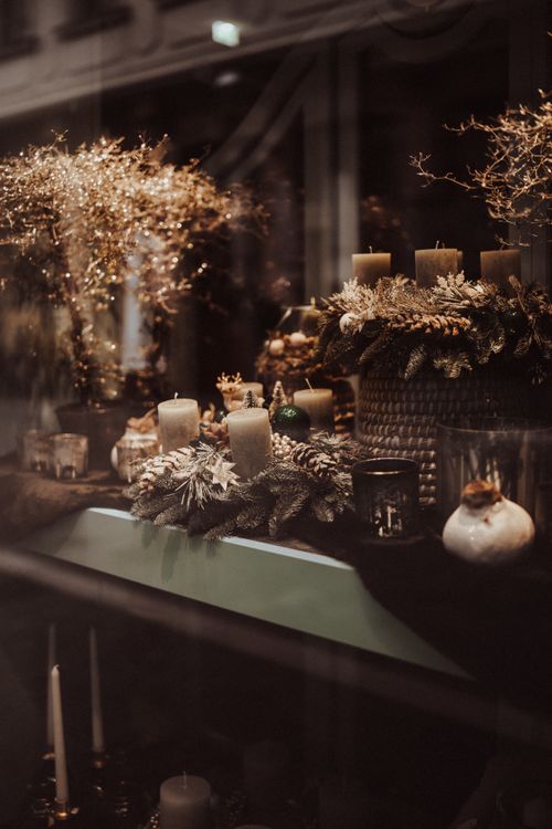 Free A festive candle display featuring decorative elements and a warm, inviting atmosphere. Stock Photo