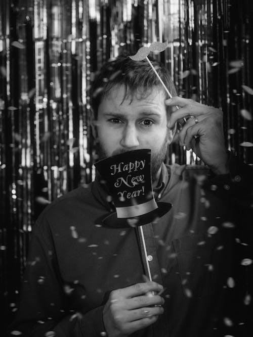 Black and White Photo of a Man Holding New Years Eve Party Photo Props 