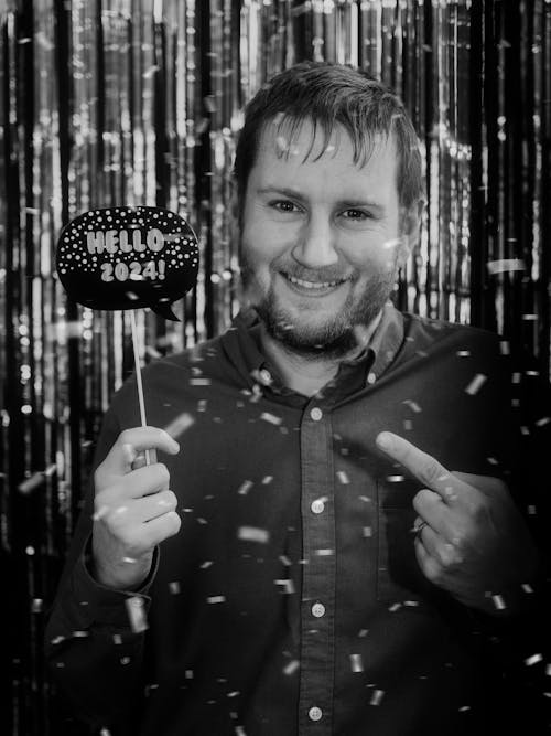 Black and White Photo of a Man Holding New Years Eve Party Photo Props 