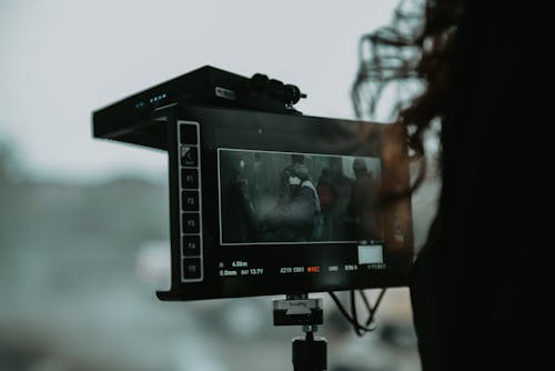 Woman Standing in Front of Video Camera · Free Stock Photo
