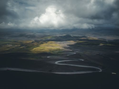 Free Aerial view of Ovejería, Pichincha showcasing dramatic clouds over a winding mountain road. Stock Photo