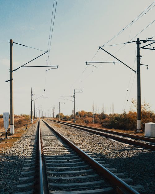 Free Beautiful autumn scene of railway tracks in Goychay, Azerbaijan, capturing the essence of fall colors. Stock Photo