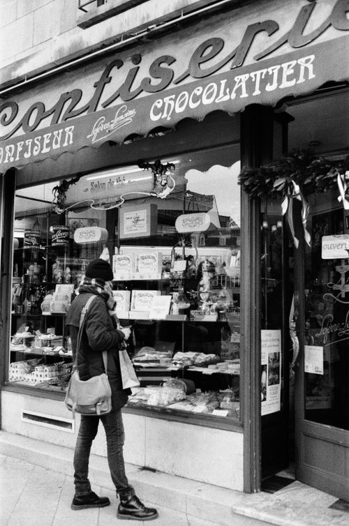 Free Person outside a chocolate shop in Nancy, France, showcasing local culture. Stock Photo