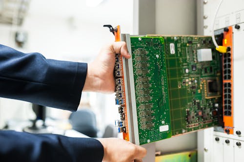 Engineer fixing core swith in data center room