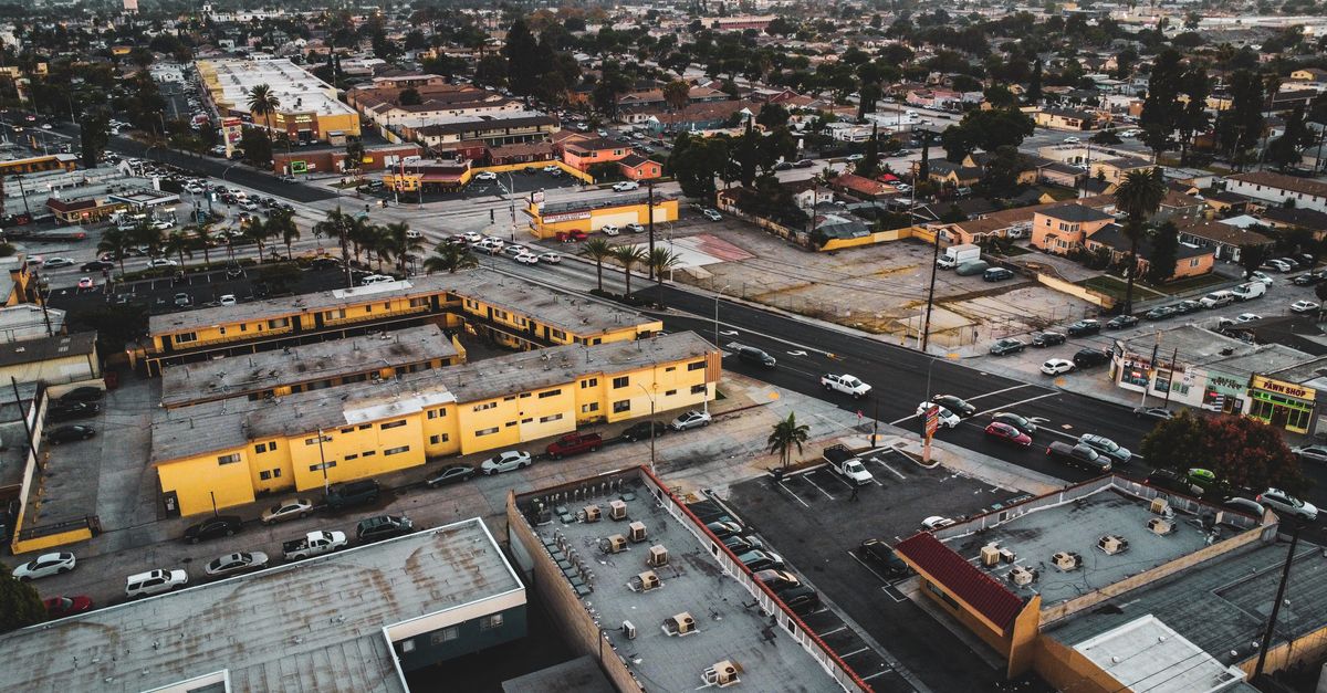 Aerial view of Los Angeles showcasing city streets, buildings, and urban layout.