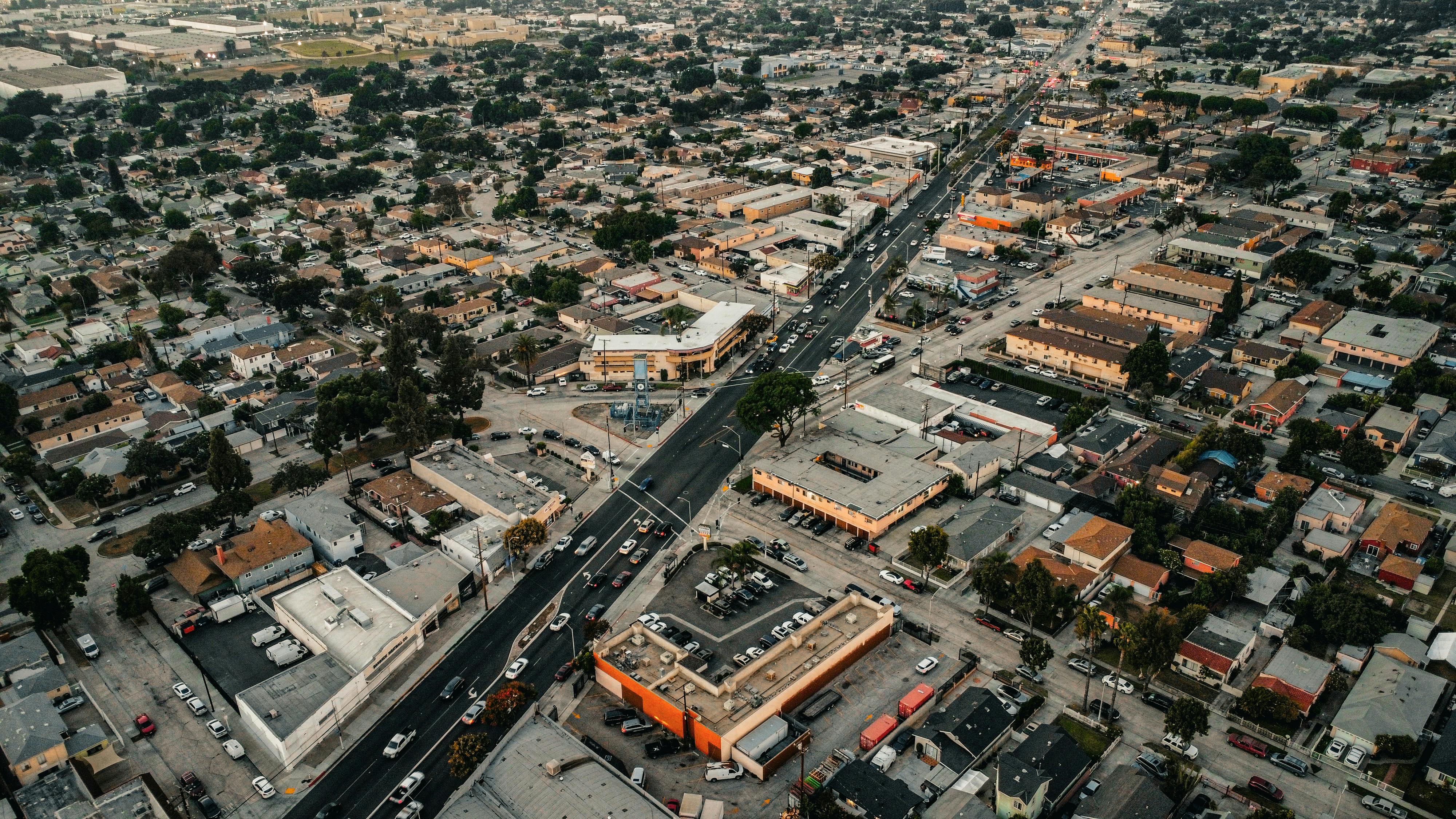 aerial view of the street through the city districts with low rise buildings