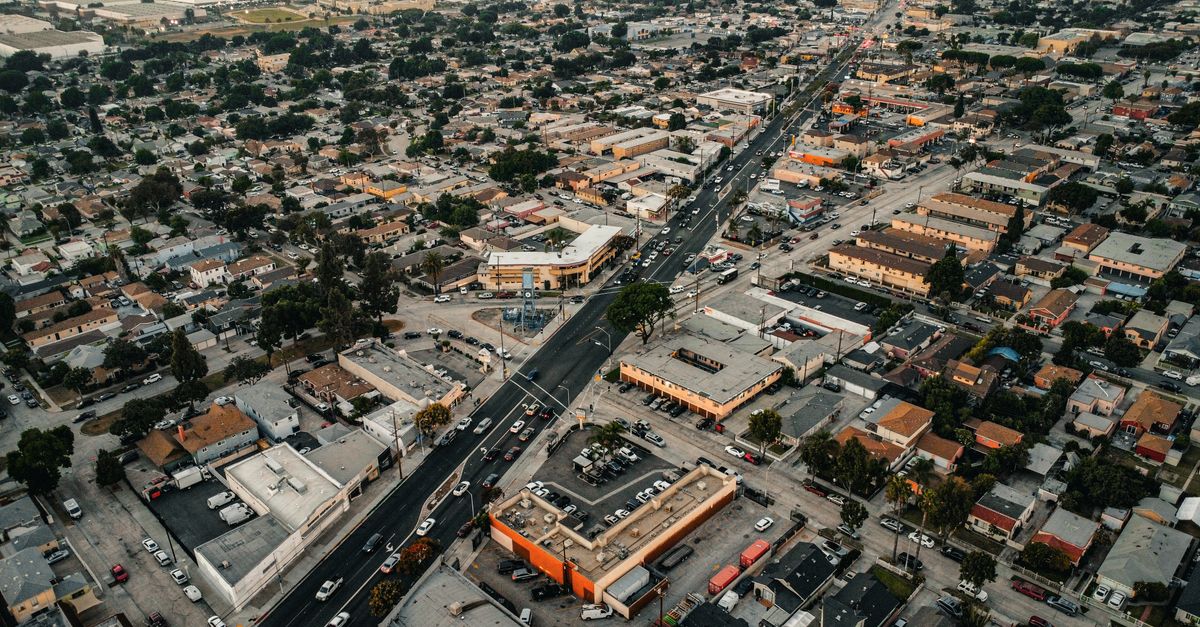 Aerial view of urban residential area in Los Angeles, showcasing streets, buildings, and city layout.