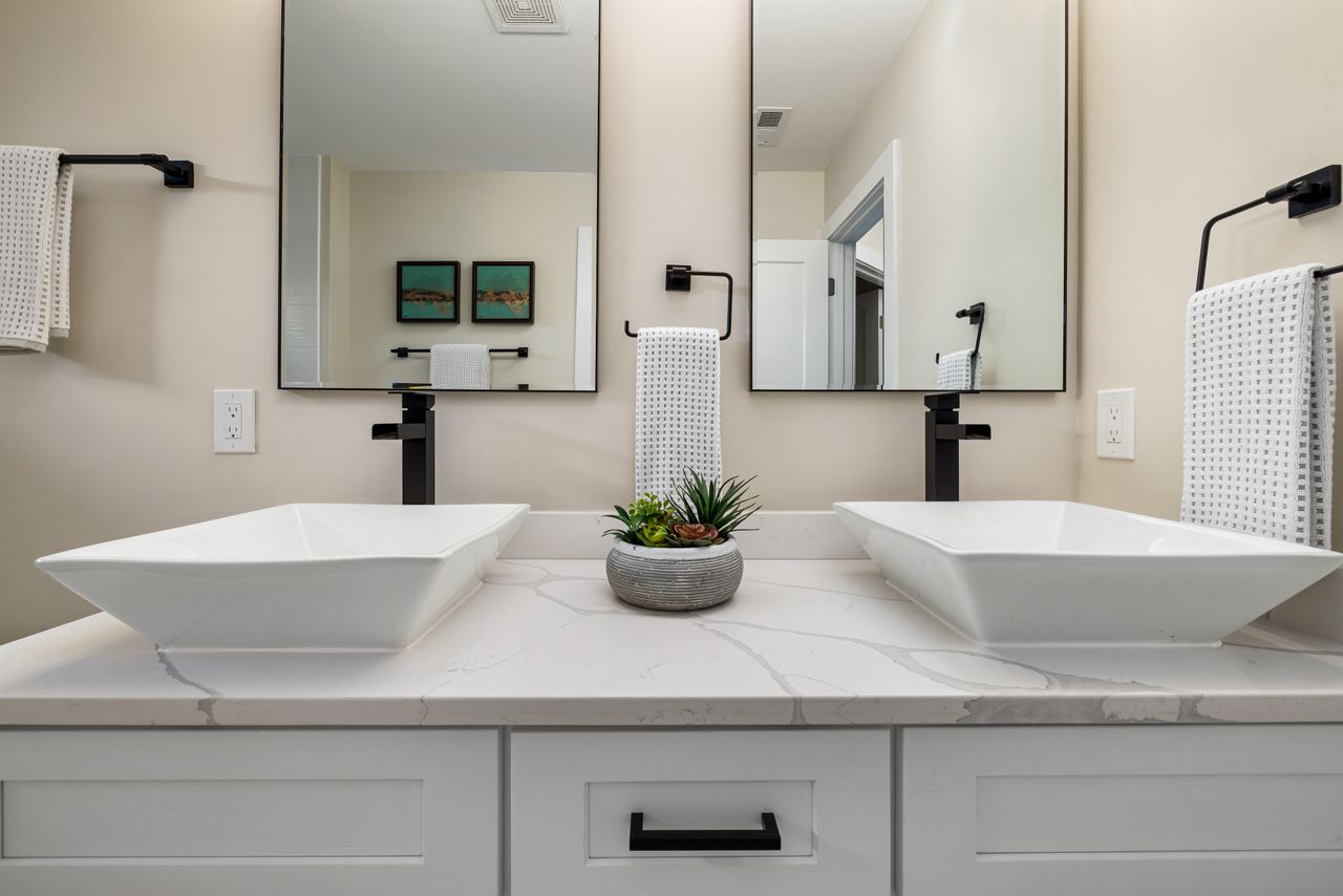 double-vessel-sink-vanity Two white vessel sinks on a double bathroom vanity