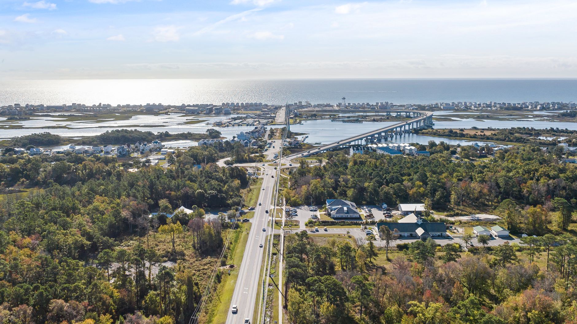 Aerial photograph of Holly Ridge, NC coastline showcasing the highway, bay, and surrounding countryside.