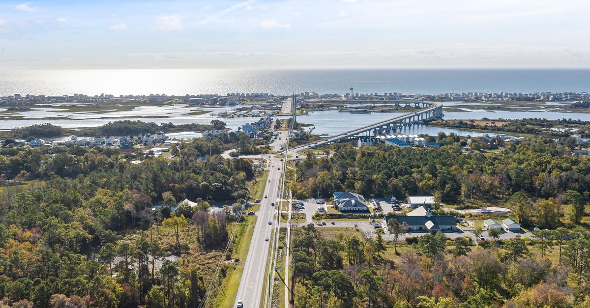 Aerial photograph of Holly Ridge, NC coastline showcasing the highway, bay, and surrounding countryside.