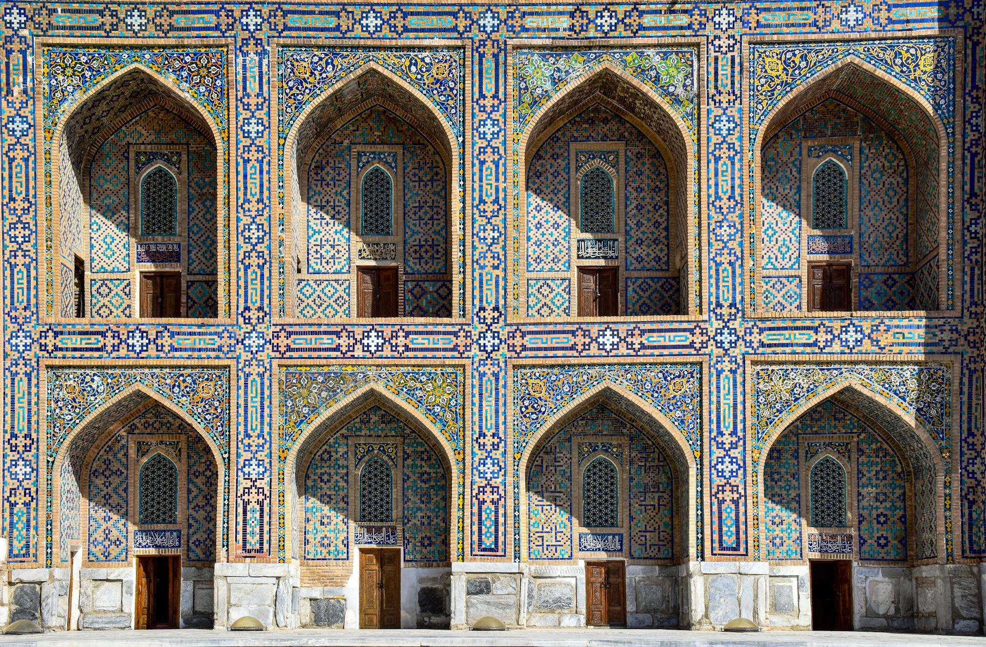 Intricate mosaic facade of Tila-Kari Madrassah, showcasing Islamic art in Samarkand.