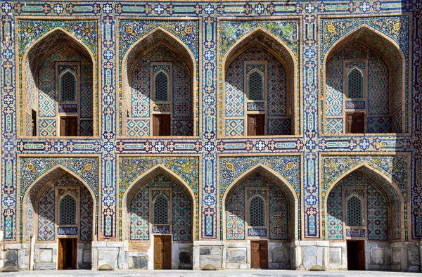 Intricate mosaic facade of Tila-Kari Madrassah, showcasing Islamic art in Samarkand.