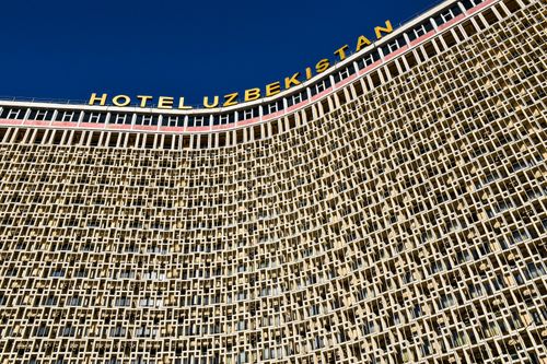 Free Detailed facade view of the Hotel Uzbekistan landmark in Tashkent, showcasing unique architecture. Stock Photo