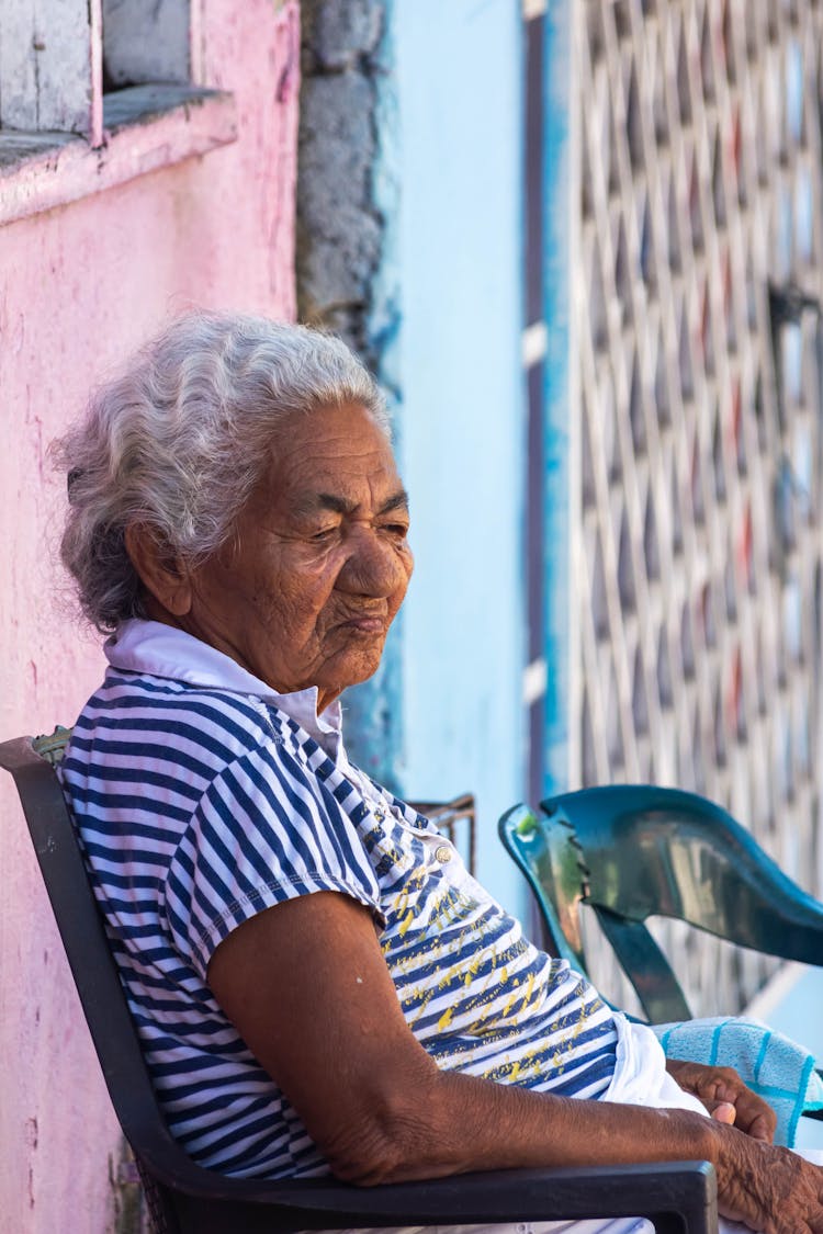 Elderly Woman Sitting On Chair