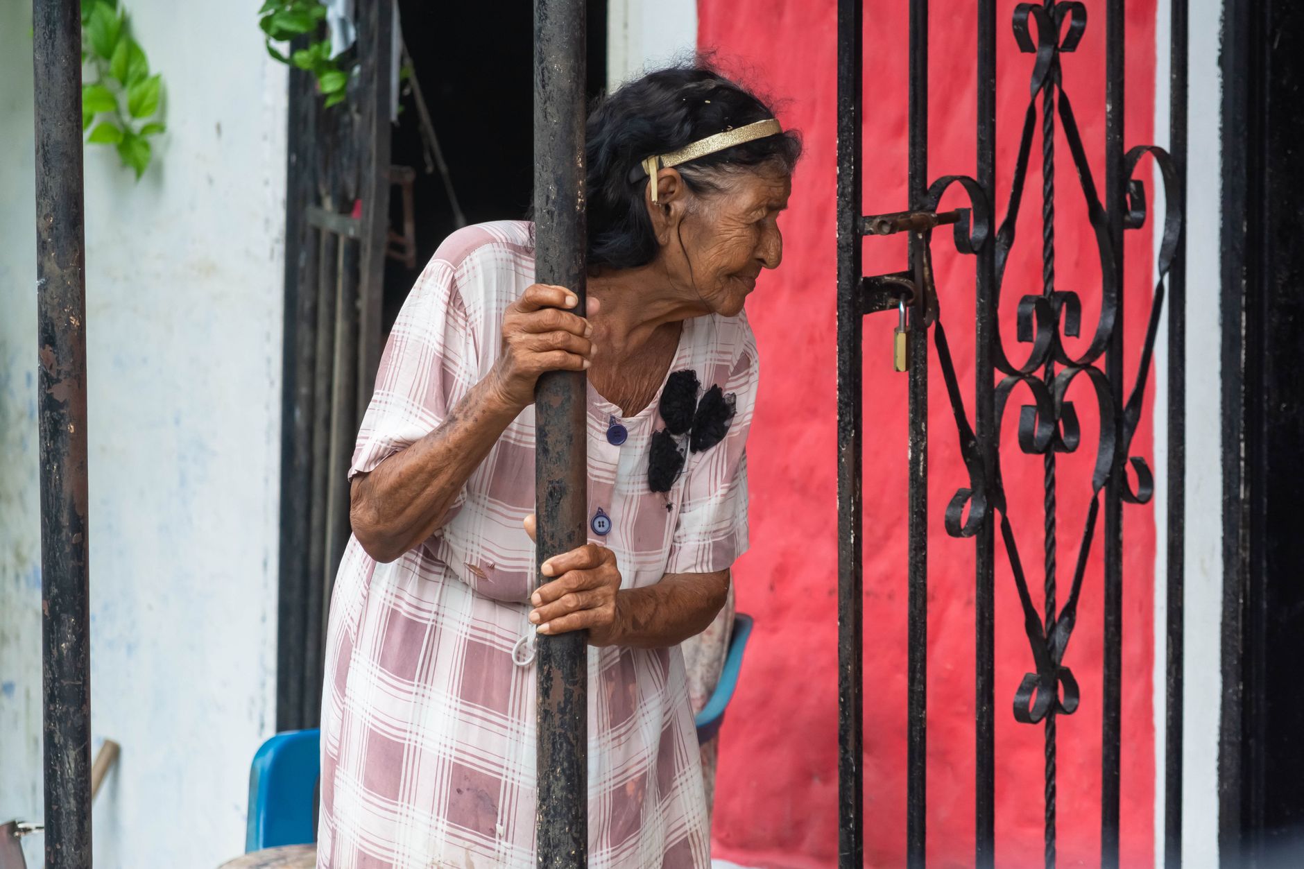 Thoughtful older woman at window in Virginia Beach — illustrating this Medicare guide