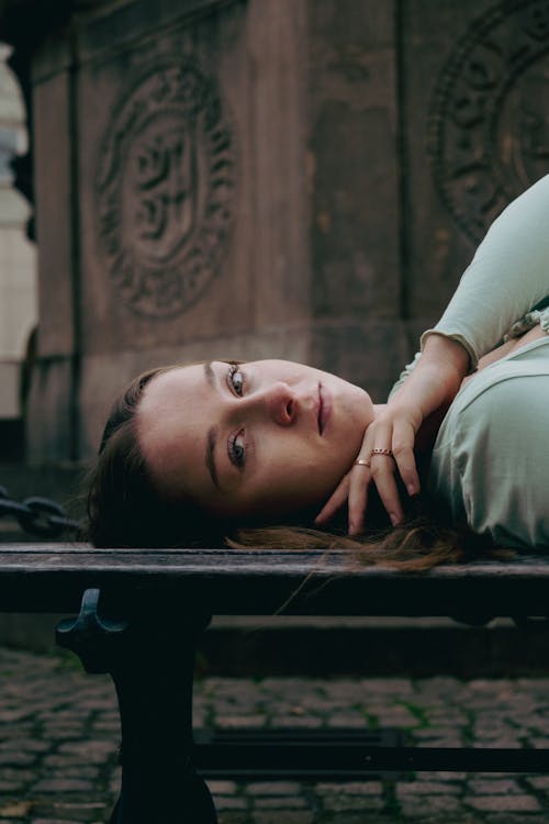 Model Lying Down on Bench