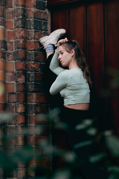 Flexible Young Woman Exercising