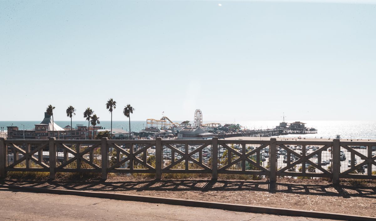 Santa Monica Pier's wooden railing and Ferris wheel, the end of Route 66