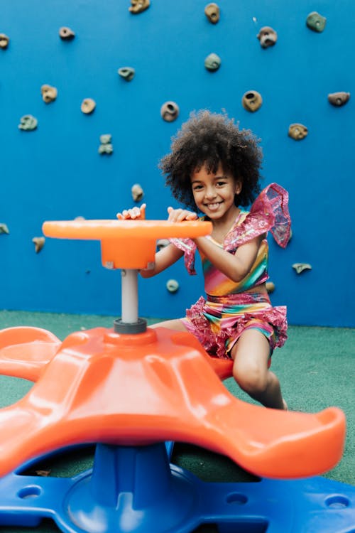 Free Cute Little Girl Playing in Playground Stock Photo