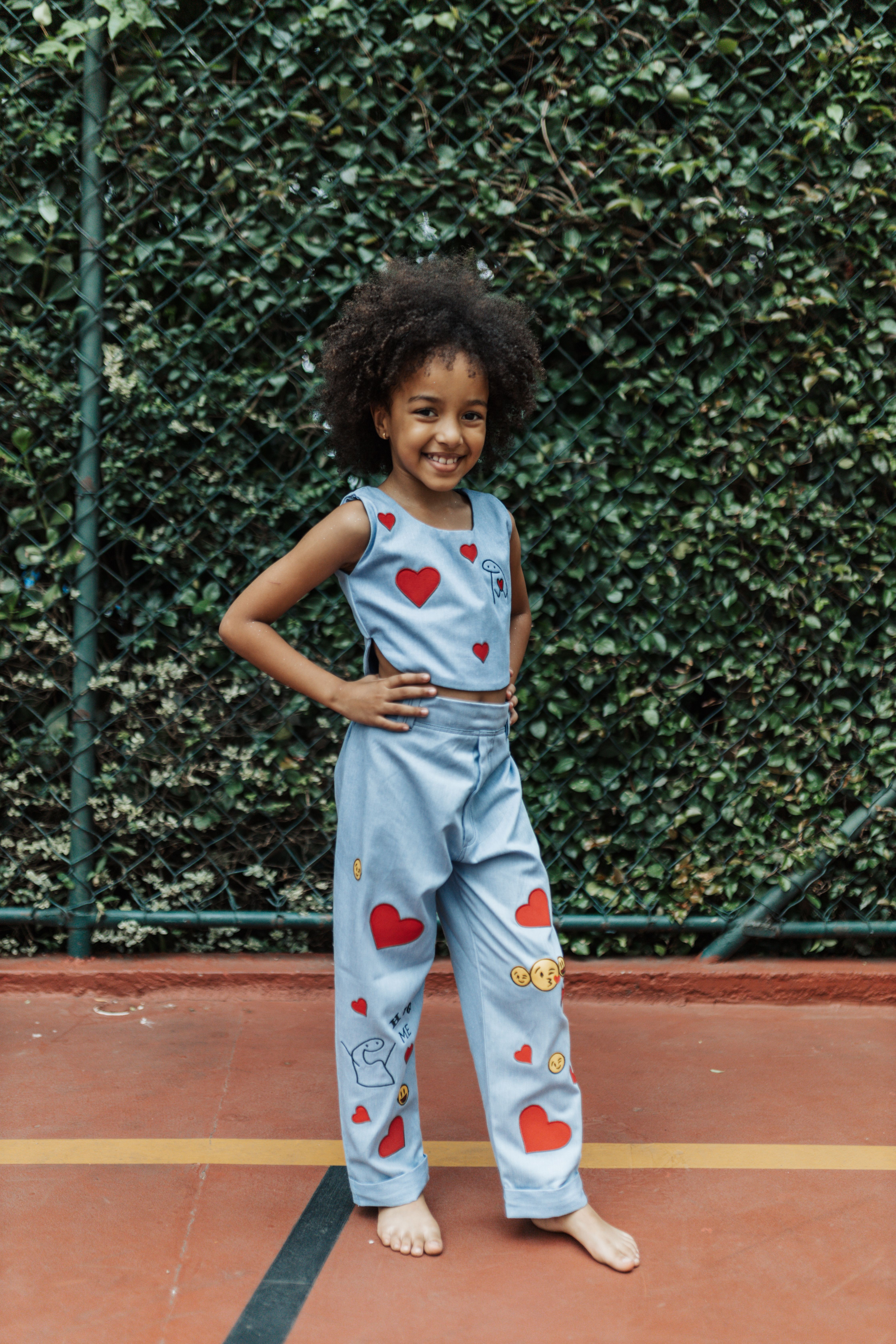 Happy Cute Little Girl in Denim Overalls · Free Stock Photo