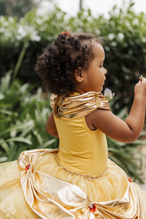 Child Model in Gold Ball Gown