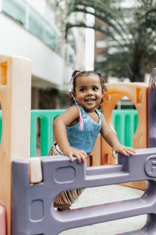 A Little Girl Having Fun on a Playground 