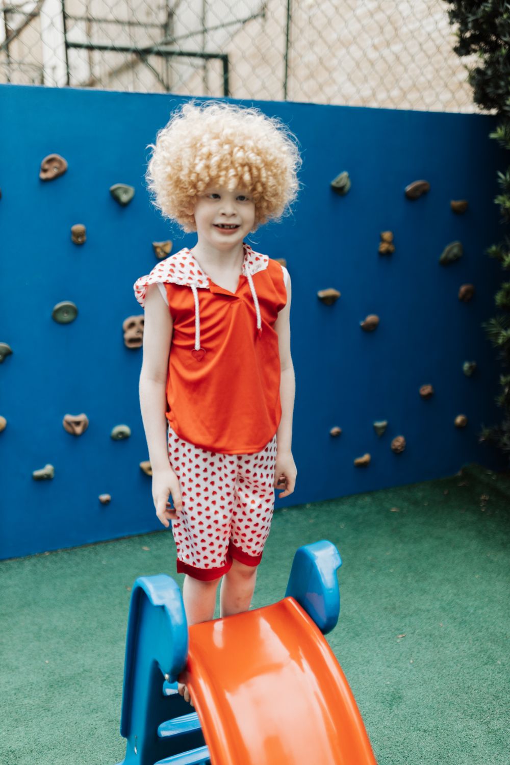 A joyful child playing on an outdoor playground