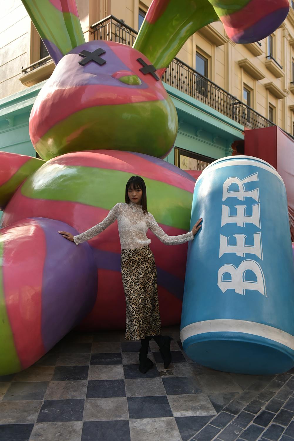 Young Woman Standing beside a Giant Colorful Rabbit Statue, Carnaby ...