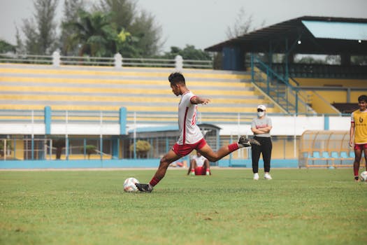 Dynamic soccer action captured during a match in Jakarta, Indonesia.